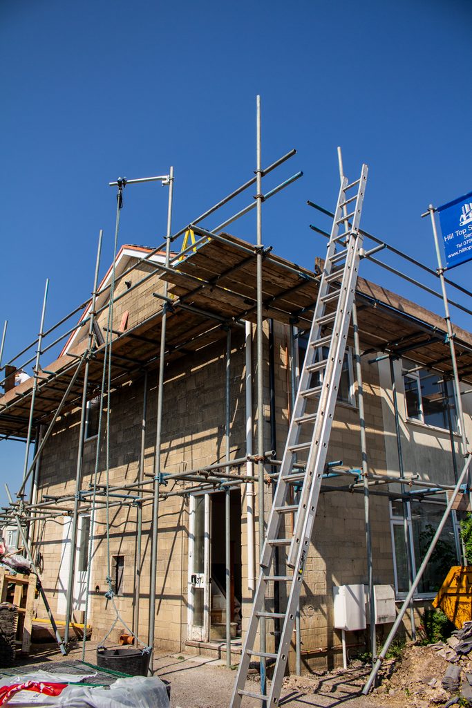 An image of a house undergoing renovation, including new doors and windows, in Frome, Somerset.